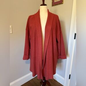 Spring weight, boiled wool coat. Open front, knee length. Subdued rust color.